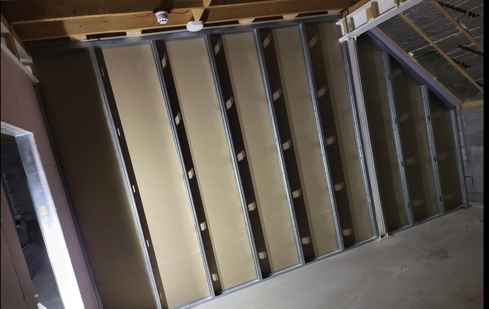 Tall partition wall with pattressing panels before boarding