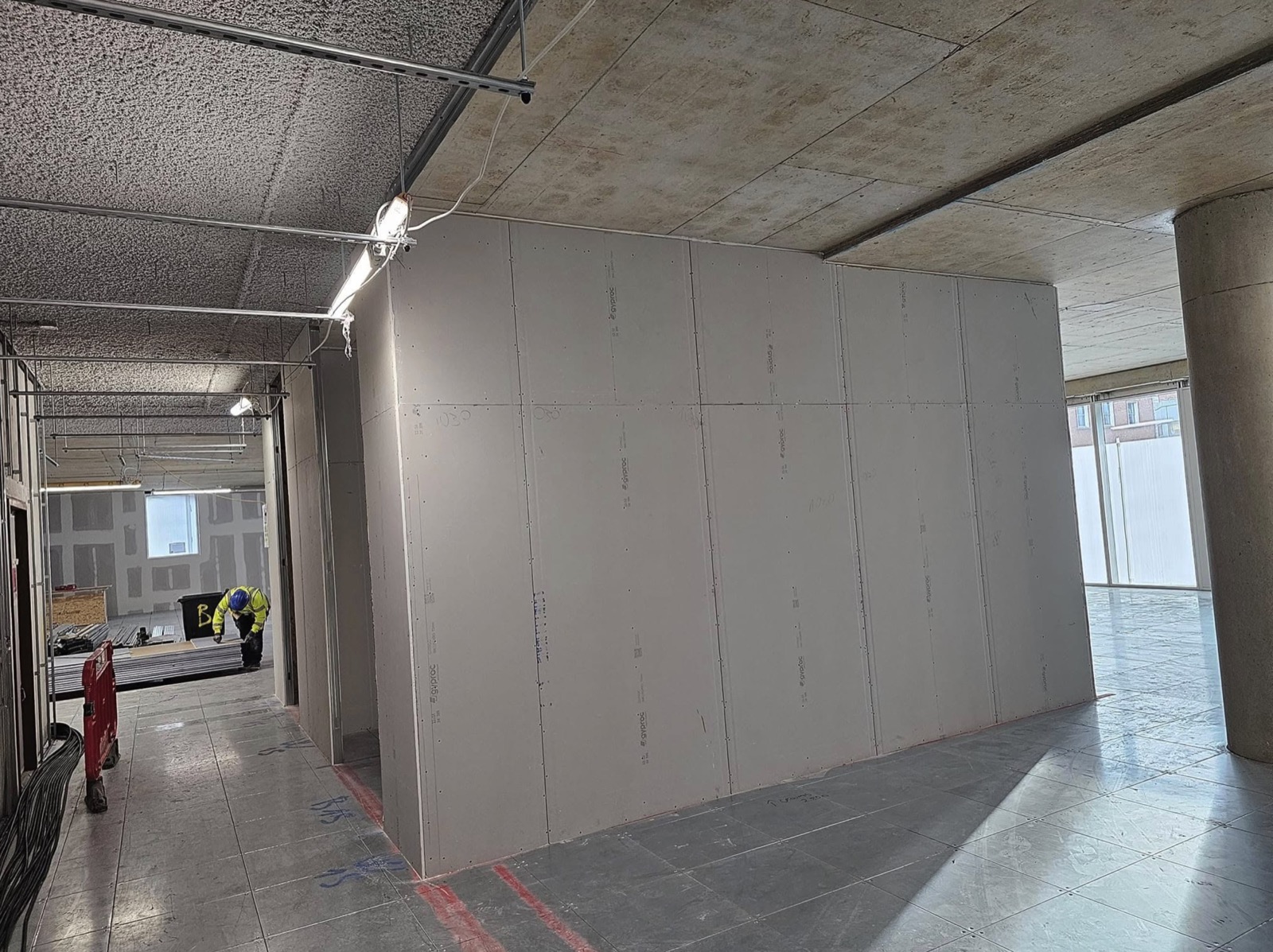 Finished plasterboard wall in a commercial corridor