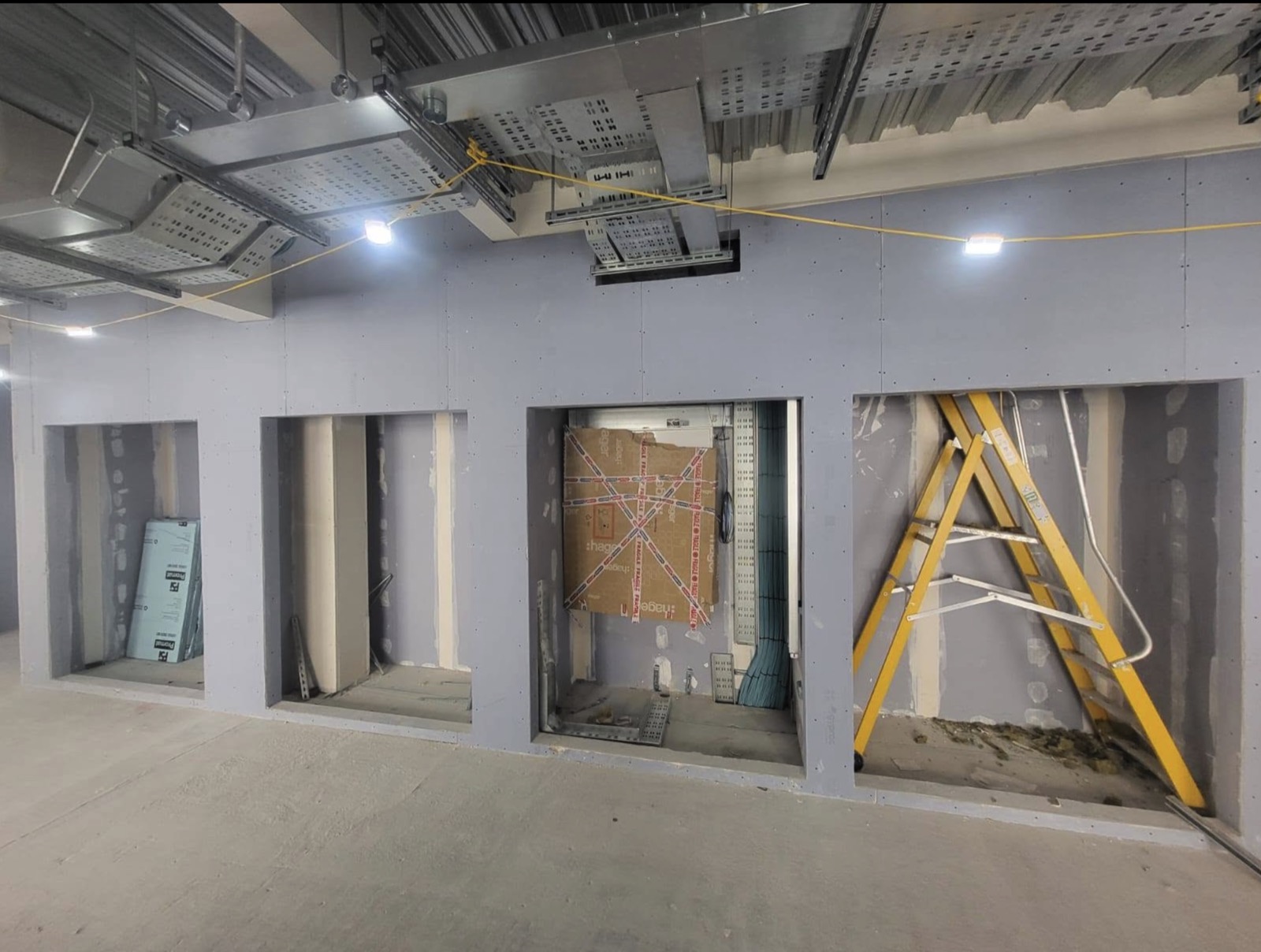 Feature wall openings with plasterboard and ceiling services above